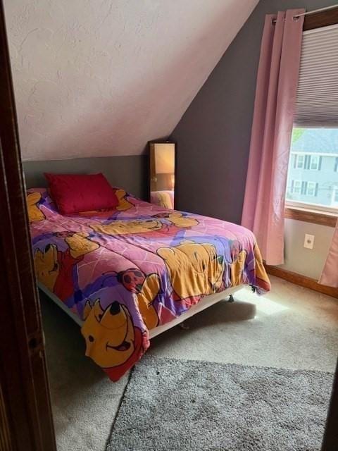 14 Pequot Rd, Weymouth, MA 02191 - carpeted bedroom with vaulted ceiling and baseboards