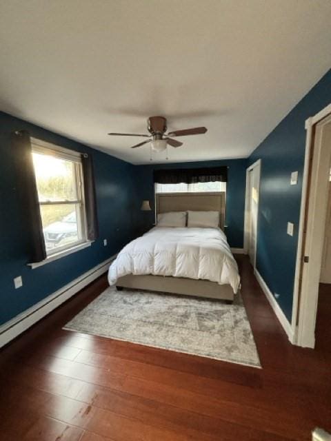 24 Congamond Rd, Southwick, MA 01077 - bedroom with a baseboard radiator, wood finished floors, ceiling fan, and baseboards