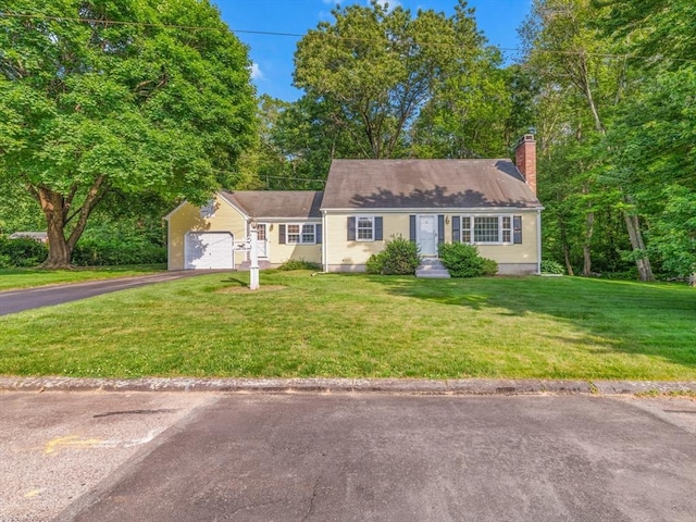 1 Winter Dr, Seekonk, MA 02771 - view of front facade featuring asphalt driveway, a front lawn, a chimney, and an attached garage