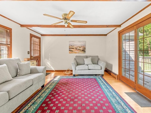 1 Winter Dr, Seekonk, MA 02771 - living area with ornamental molding, wood finished floors, a baseboard heating unit, and a ceiling fan