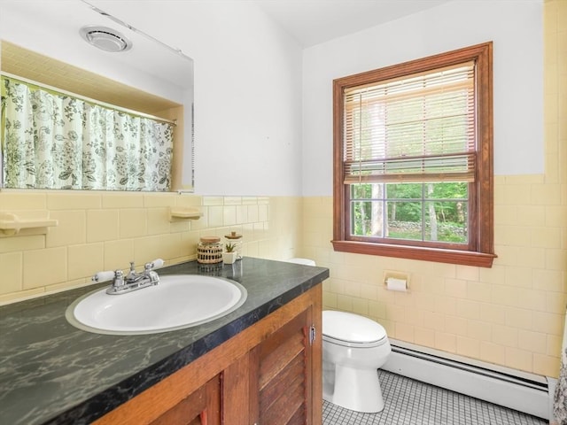1 Winter Dr, Seekonk, MA 02771 - bathroom featuring baseboard heating, tile walls, tile patterned floors, vanity, and a wainscoted wall