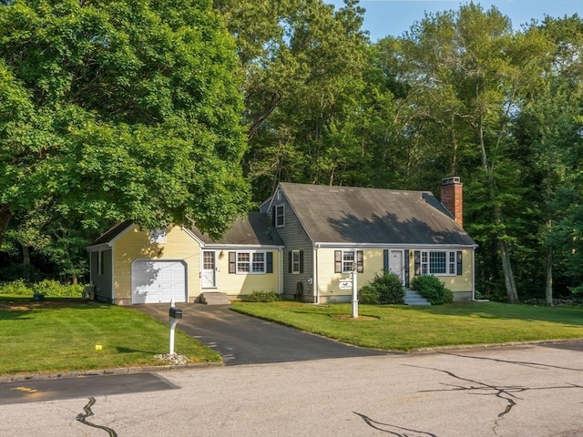 1 Winter Dr, Seekonk, MA 02771 - new england style home with asphalt driveway, an attached garage, a front yard, and a chimney