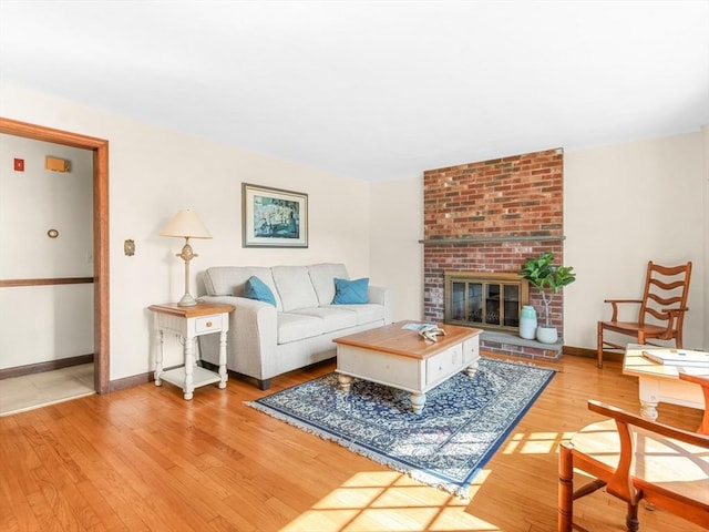 1 Winter Dr, Seekonk, MA 02771 - living area with wood finished floors and a brick fireplace