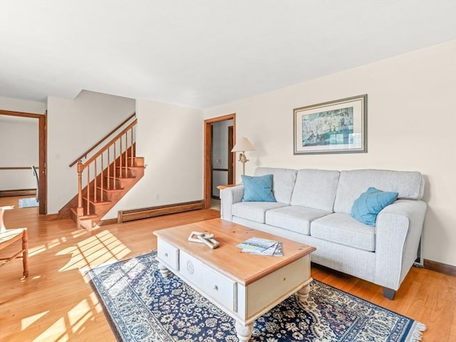 1 Winter Dr, Seekonk, MA 02771 - living area featuring a baseboard heating unit, stairs, and wood finished floors
