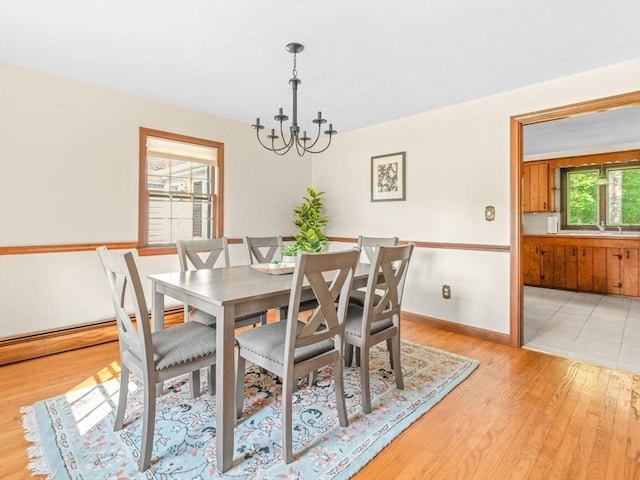1 Winter Dr, Seekonk, MA 02771 - dining space with a chandelier and light wood-style floors