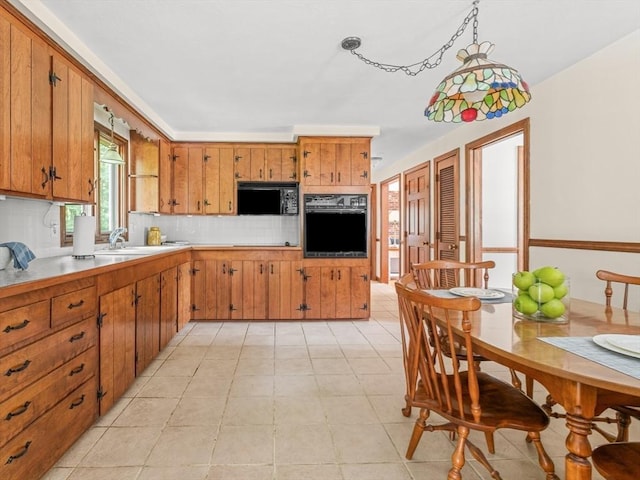 1 Winter Dr, Seekonk, MA 02771 - kitchen with black appliances, brown cabinetry, light countertops, and decorative backsplash