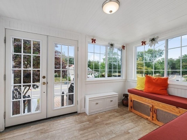 sunroom with a wealth of natural light and french doors