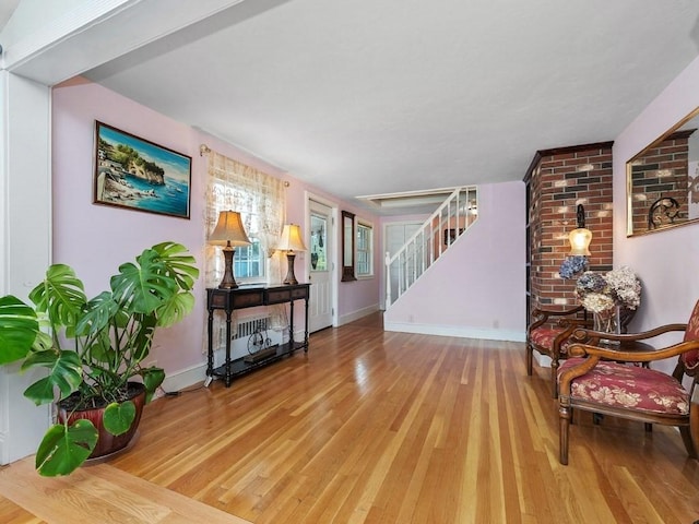 sitting room featuring light hardwood / wood-style flooring