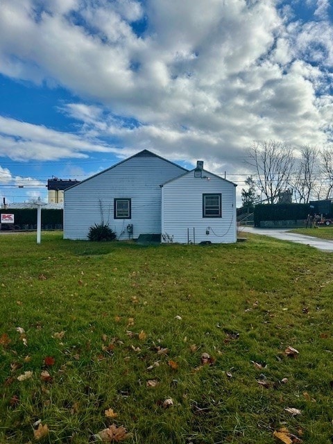 view of home's exterior featuring a lawn