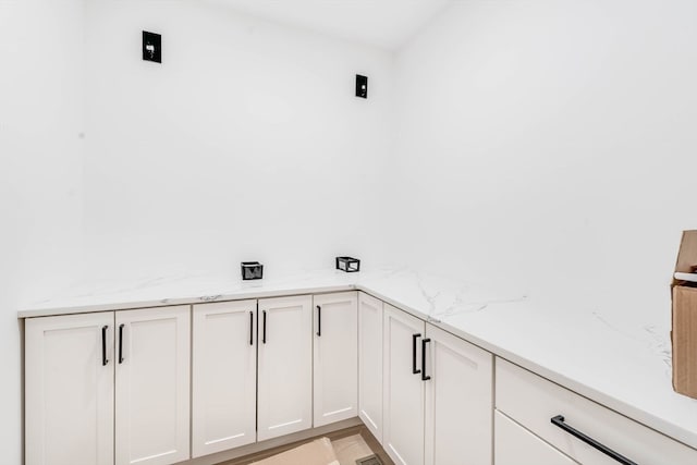 laundry area featuring light hardwood / wood-style floors