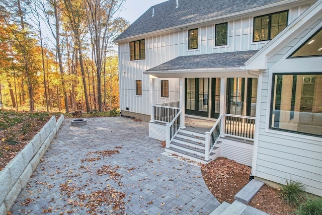 rear view of house with a patio and covered porch