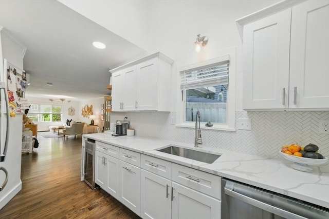 14 Turning Mill Ln Unit 14, Quincy, MA 02169 - kitchen featuring dishwasher, wine cooler, white cabinets, backsplash, and dark wood finished floors