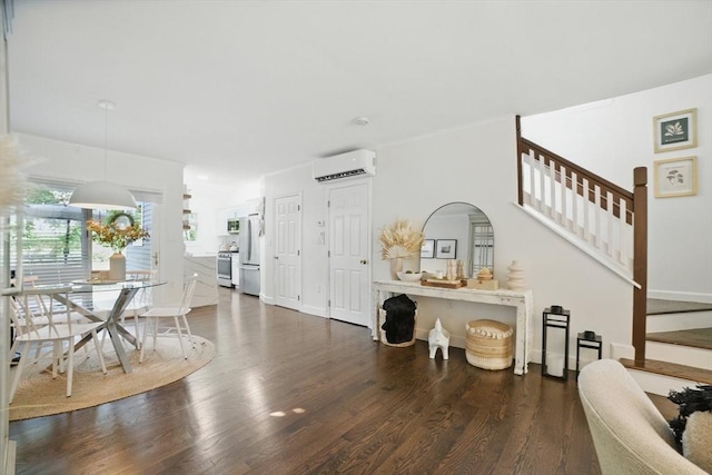 14 Turning Mill Ln Unit 14, Quincy, MA 02169 - dining area featuring an AC wall unit, stairway, and dark wood-type flooring