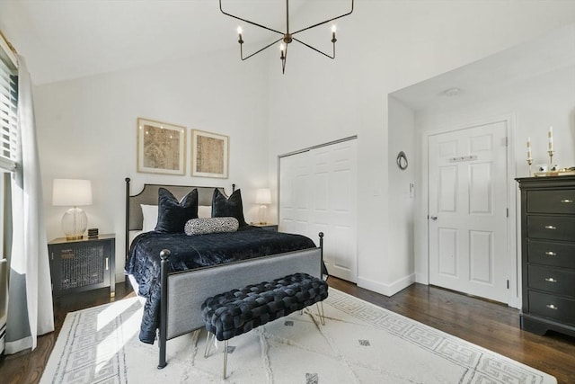 14 Turning Mill Ln Unit 14, Quincy, MA 02169 - bedroom featuring dark wood-type flooring, a chandelier, high vaulted ceiling, and a closet