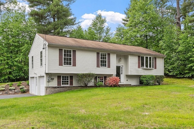 24 Joel Scott Dr, Holden, MA 01520 - raised ranch featuring a garage, driveway, and a front lawn