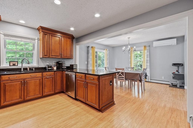 24 Joel Scott Dr, Holden, MA 01520 - kitchen with a wall mounted AC, stainless steel dishwasher, brown cabinets, a sink, and light wood-style floors