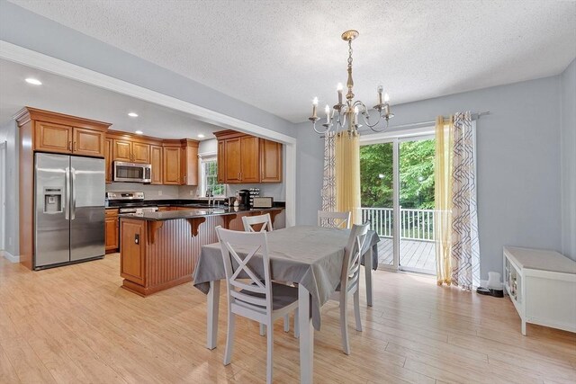 24 Joel Scott Dr, Holden, MA 01520 - dining space featuring a chandelier, light wood-style floors, a textured ceiling, and recessed lighting