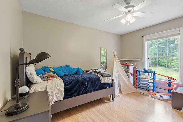 24 Joel Scott Dr, Holden, MA 01520 - bedroom with wood finished floors, a textured ceiling, and a ceiling fan