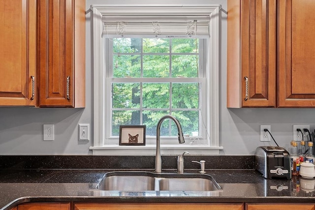 24 Joel Scott Dr, Holden, MA 01520 - kitchen featuring a sink, brown cabinetry, and dark stone countertops