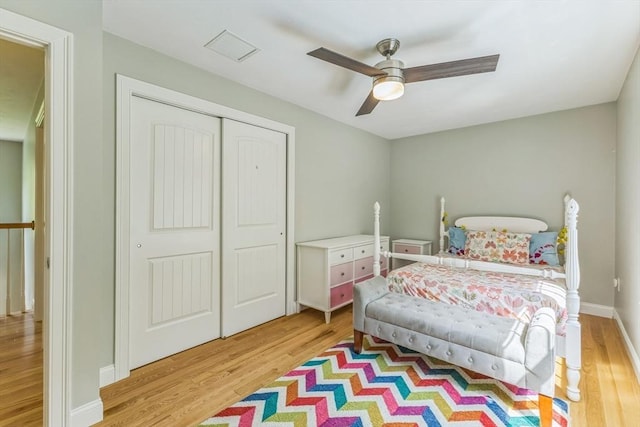 82 Sutton St, Uxbridge, MA 01569 - bedroom with light wood-type flooring, a closet, a ceiling fan, and baseboards