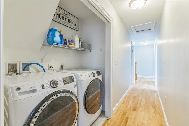 82 Sutton St, Uxbridge, MA 01569 - laundry area with light wood finished floors, washer and dryer, and baseboards