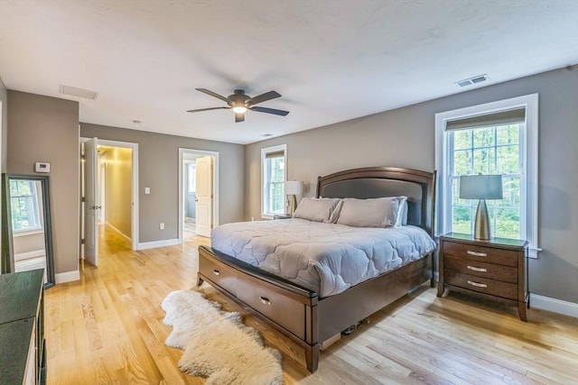 82 Sutton St, Uxbridge, MA 01569 - bedroom with light wood-type flooring, baseboards, ensuite bath, and ceiling fan