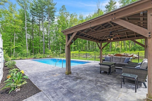 82 Sutton St, Uxbridge, MA 01569 - view of swimming pool featuring a gazebo, a patio area, an outdoor hangout area, a fenced backyard, and ceiling fan
