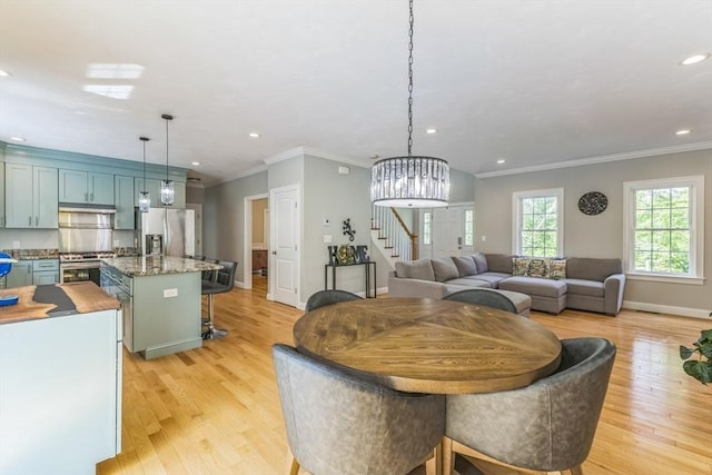 82 Sutton St, Uxbridge, MA 01569 - dining room featuring stairway, light wood-type flooring, baseboards, recessed lighting, and ornamental molding