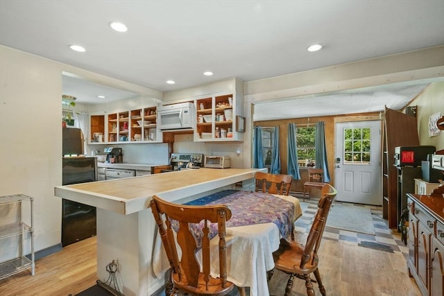 41 Endicott St, Danvers, MA 01923 - kitchen with white appliances, light wood-style floors, open shelves, recessed lighting, and a peninsula