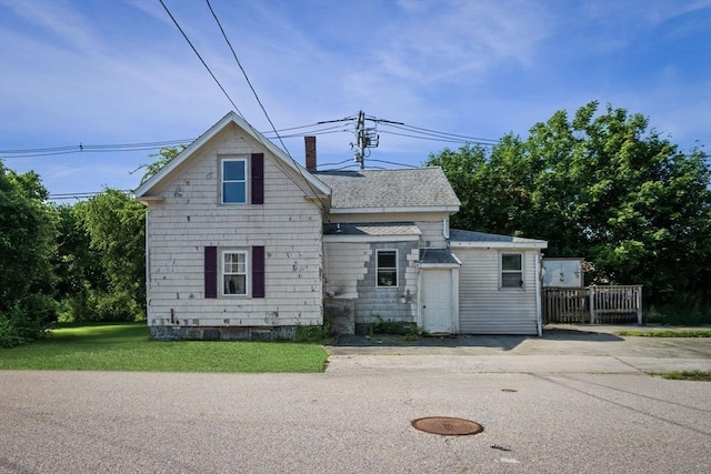 41 Endicott St, Danvers, MA 01923 - view of front of house with a chimney, roof with shingles, and a front yard