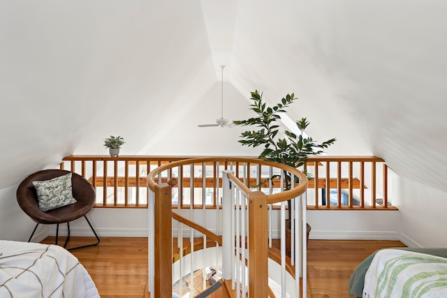 bedroom with light hardwood / wood-style flooring and lofted ceiling with beams