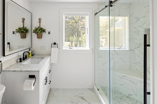 bathroom with an enclosed shower and vanity