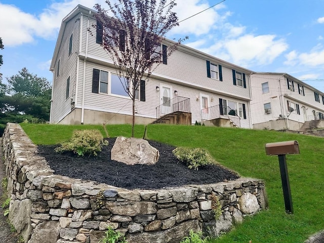 back of house featuring a yard