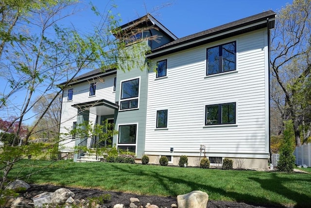 147 Ridge St, Arlington, MA 02474 - back of house with a lawn