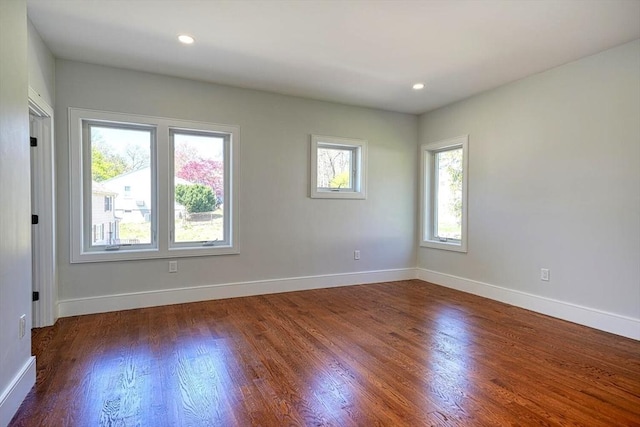 147 Ridge St, Arlington, MA 02474 - empty room with baseboards, recessed lighting, and wood finished floors