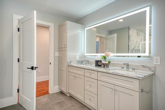 147 Ridge St, Arlington, MA 02474 - bathroom with a sink, tile patterned floors, a shower with shower door, and double vanity