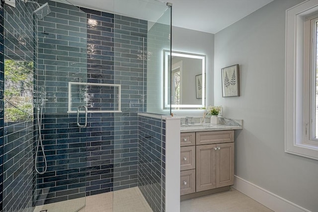 147 Ridge St, Arlington, MA 02474 - bathroom with baseboards, a tile shower, tile patterned floors, and vanity