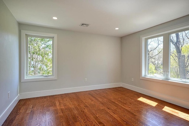 147 Ridge St, Arlington, MA 02474 - spare room featuring baseboards, recessed lighting, wood finished floors, and visible vents