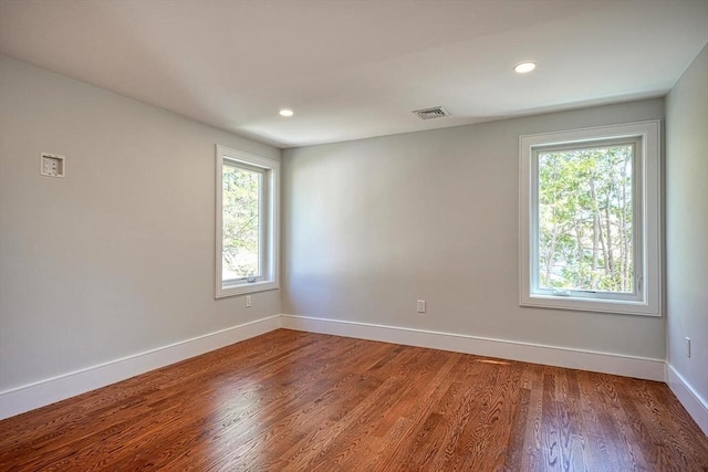 147 Ridge St, Arlington, MA 02474 - unfurnished room featuring baseboards, recessed lighting, wood finished floors, and visible vents