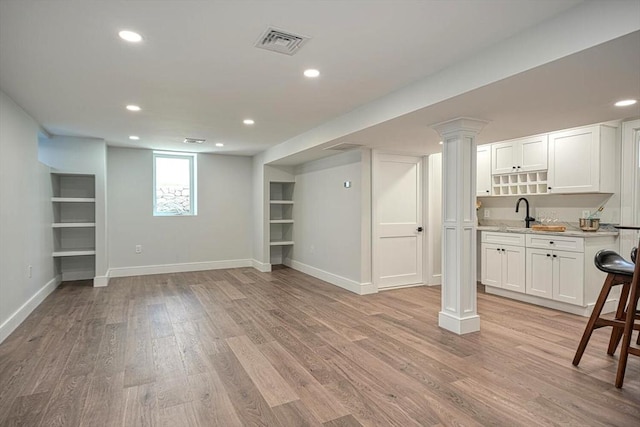 147 Ridge St, Arlington, MA 02474 - below grade area featuring recessed lighting, baseboards, visible vents, and light wood-style floors