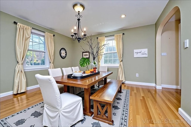 24 E St, Weymouth, MA 02189 - dining room featuring arched walkways, light wood finished floors, a chandelier, and recessed lighting