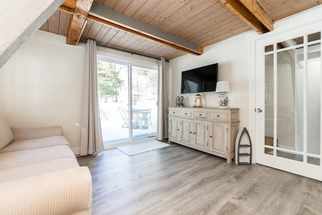 living room with wood ceiling, beamed ceiling, and light wood-type flooring