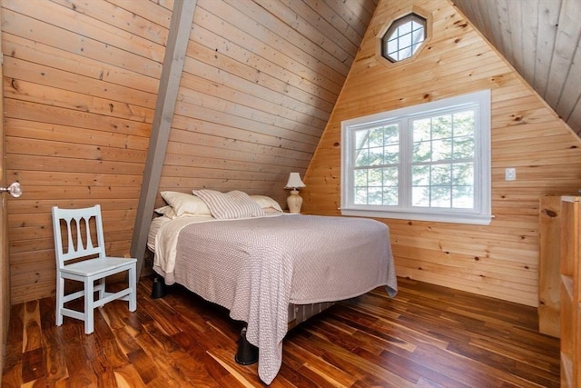 bedroom with lofted ceiling, dark wood-type flooring, wood ceiling, and wooden walls