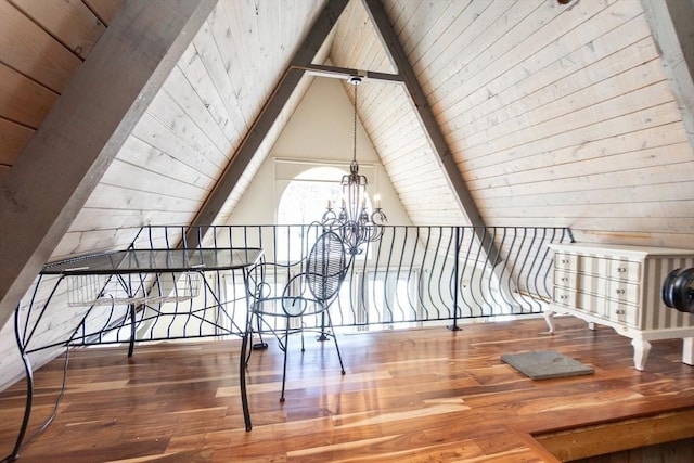 bonus room with hardwood / wood-style flooring, lofted ceiling with beams, wooden ceiling, and a chandelier