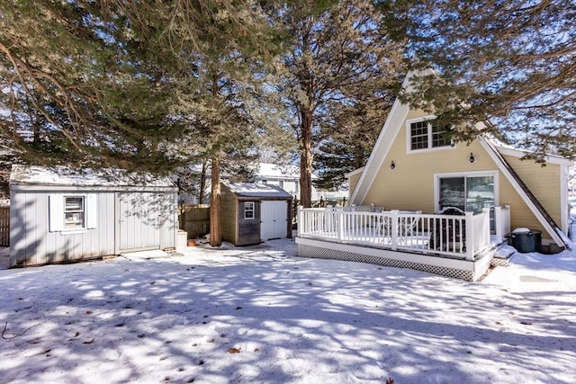 exterior space with a deck and a storage unit