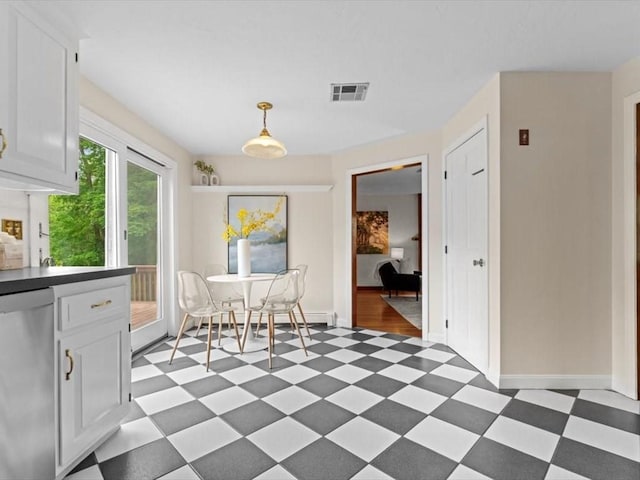 769 Edgell Rd, Framingham, MA 01701 - dining area featuring light flooring, baseboards, and baseboard heating