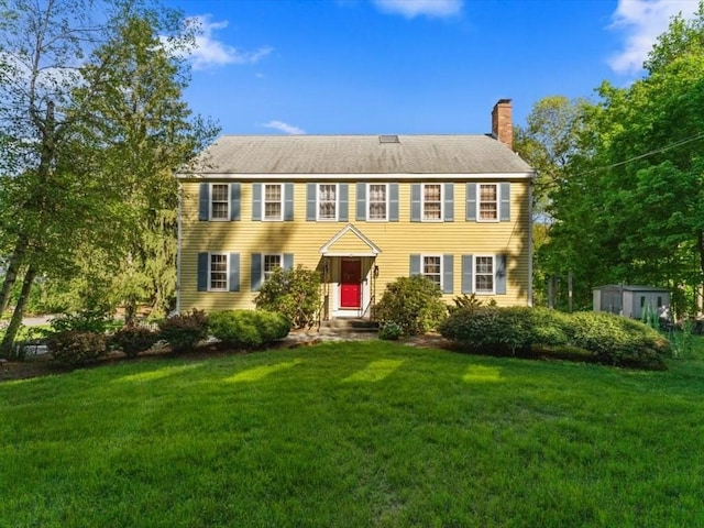 769 Edgell Rd, Framingham, MA 01701 - colonial home featuring a chimney and a front yard