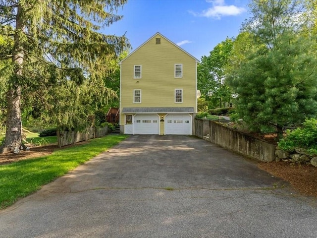 769 Edgell Rd, Framingham, MA 01701 - view of side of property with asphalt driveway and an attached garage