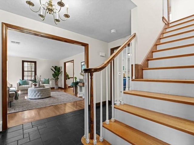769 Edgell Rd, Framingham, MA 01701 - stairway with a chandelier