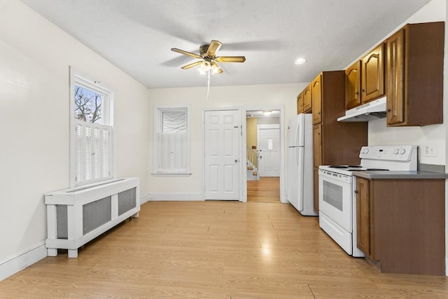 kitchen featuring ceiling fan, white appliances, and light wood-type flooring